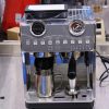 Two in one coffee machine together with its grinder